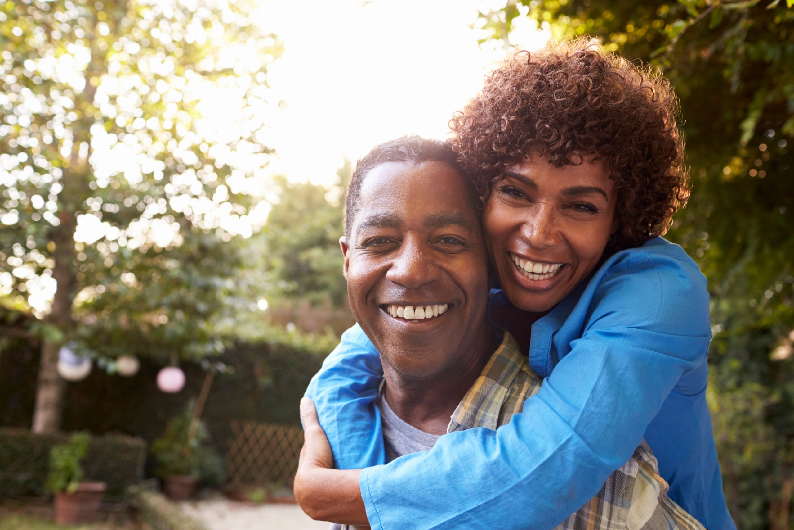 A couple celebrating their new 10-year mortgage low rates.