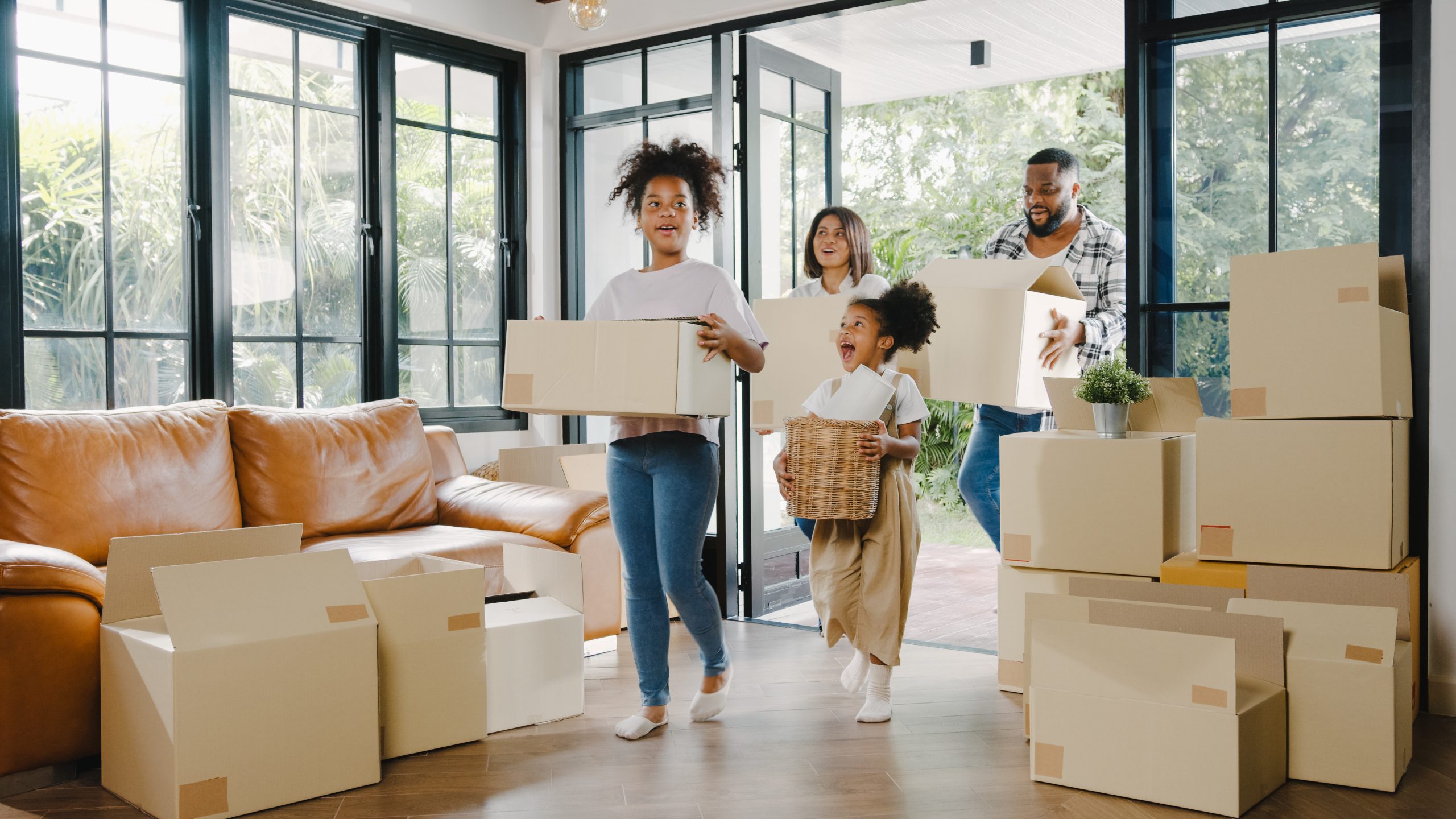 Family moving into a new house thanks to a jumbo mortgage loan from Argent Credit Union.