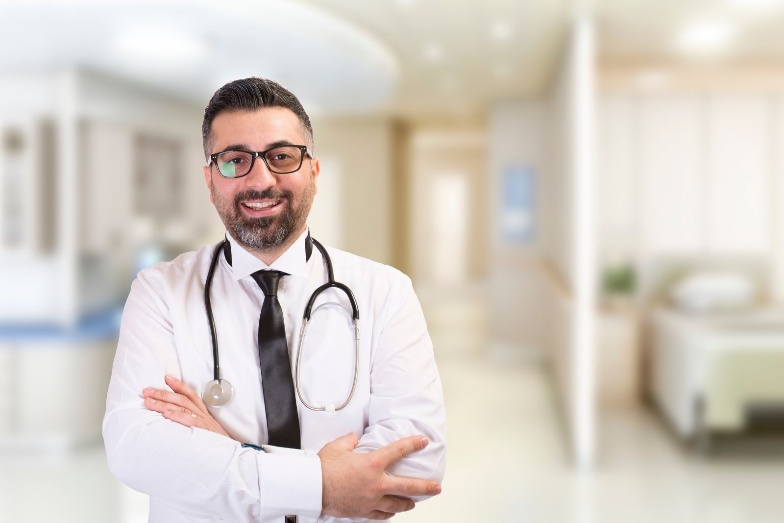 a doctor stands in his home office.